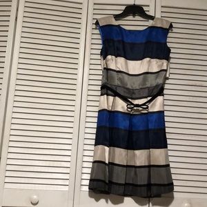 Multi color dress, never worn,black belt included.